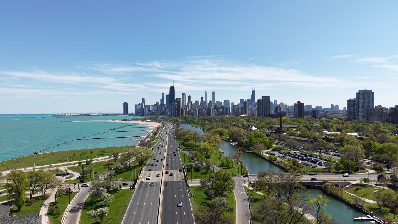 Chicago USA, Drone Shot of Downtown Skyline, Lake Michigan and Lake Shore Drive Traffic on Sunny Day
