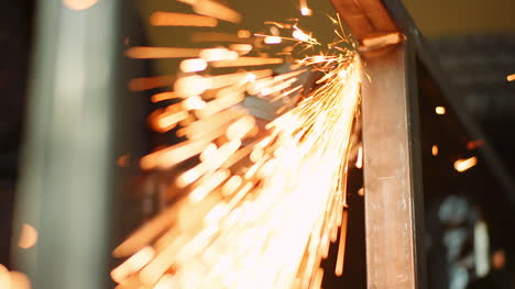 industry worker grinding metal with angle grinder 7