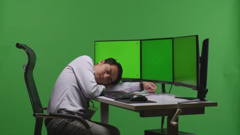 tired employee sleeping at desk