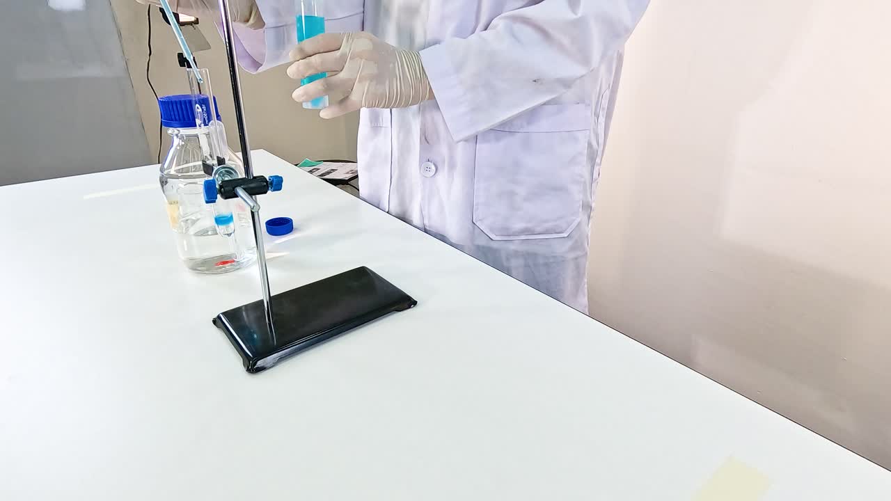 Scientist conducts NaOH chemical reaction in a lab setting, using precise instruments and safety gear under controlled lighting