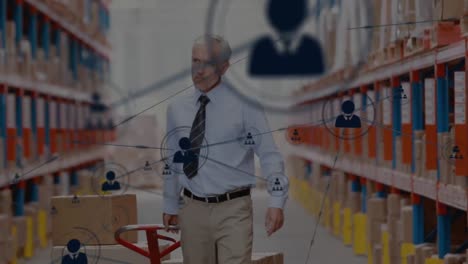 network of profile icons against caucasian male senior supervisor pulling a pallet at warehouse