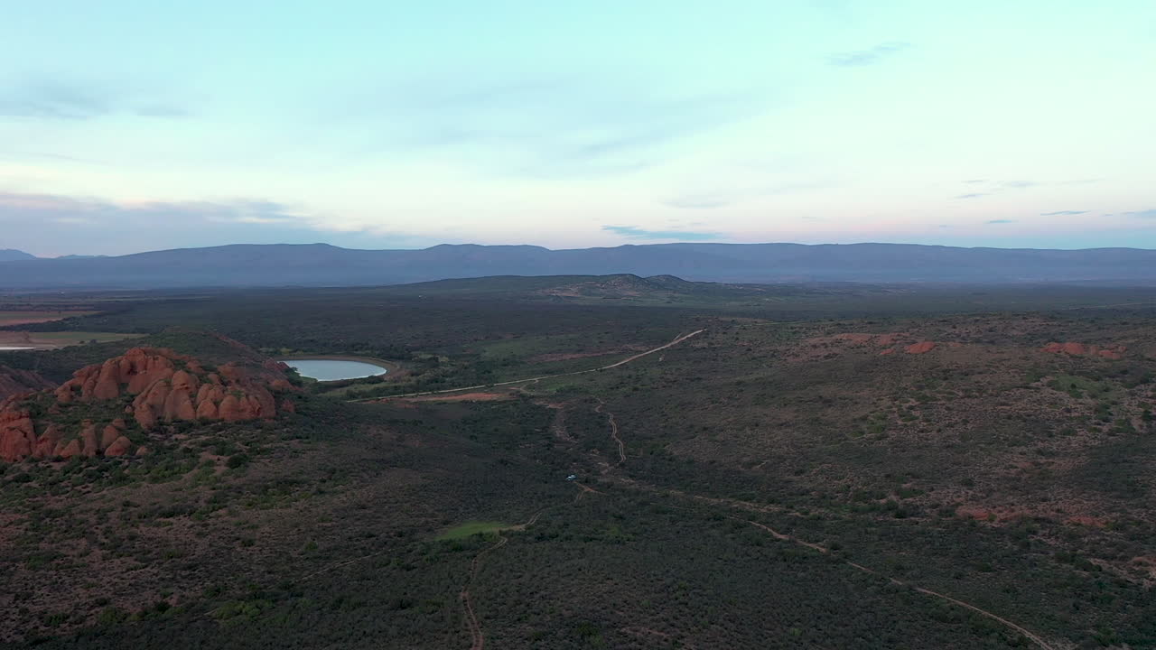 Flat horizon with mountain range Drone shot track in slow motion