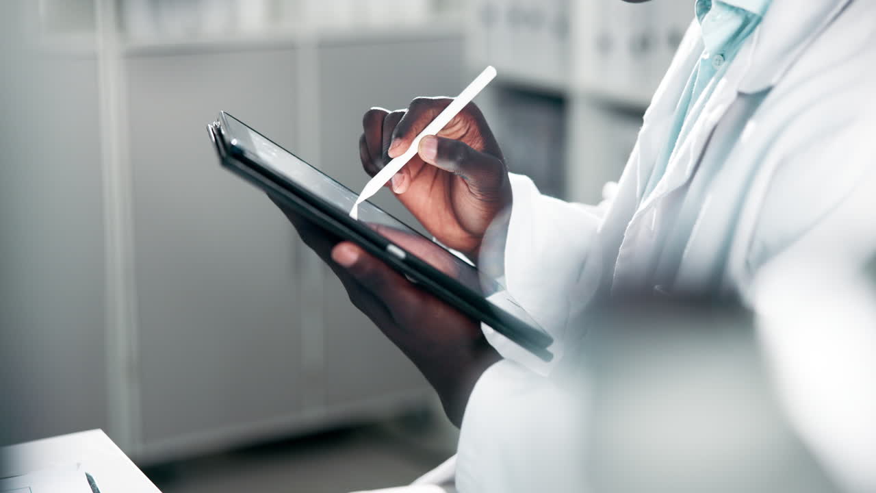 Scientist using a tablet in a lab