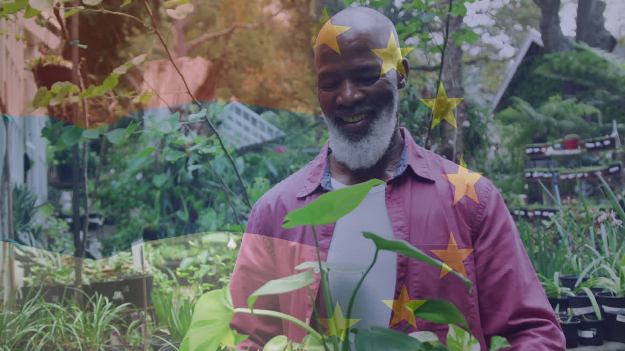 Smiling man tending plants in garden with star animation overlay