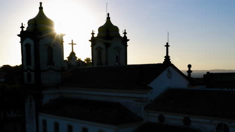 aerial view of nosso senhor do bonfim church back side, the neighbourhood and the ocean at background, at sunset, salvador, bahia, brazil