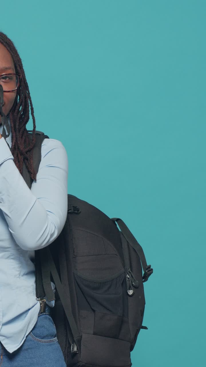 Female photographer with camera and backpack