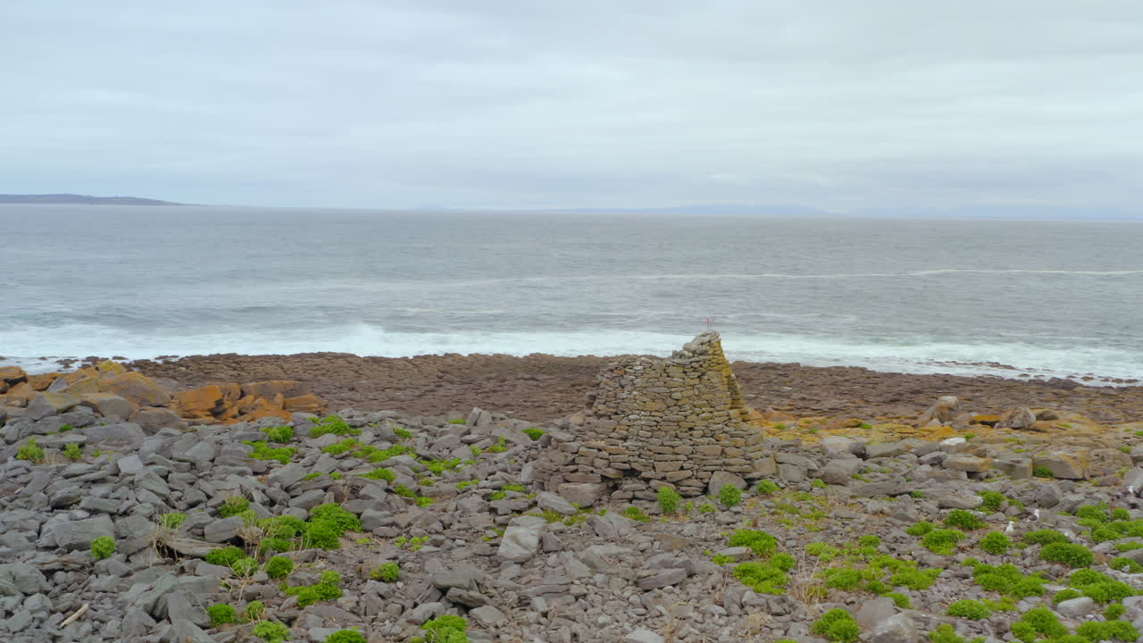Wild Atlantic Ocean off the coast of County Clare with Crab's Island Constabulary outpost in foreground