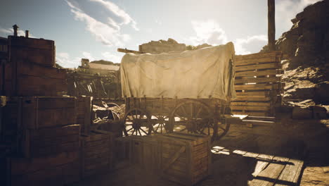 old covered wagon in a western desert town