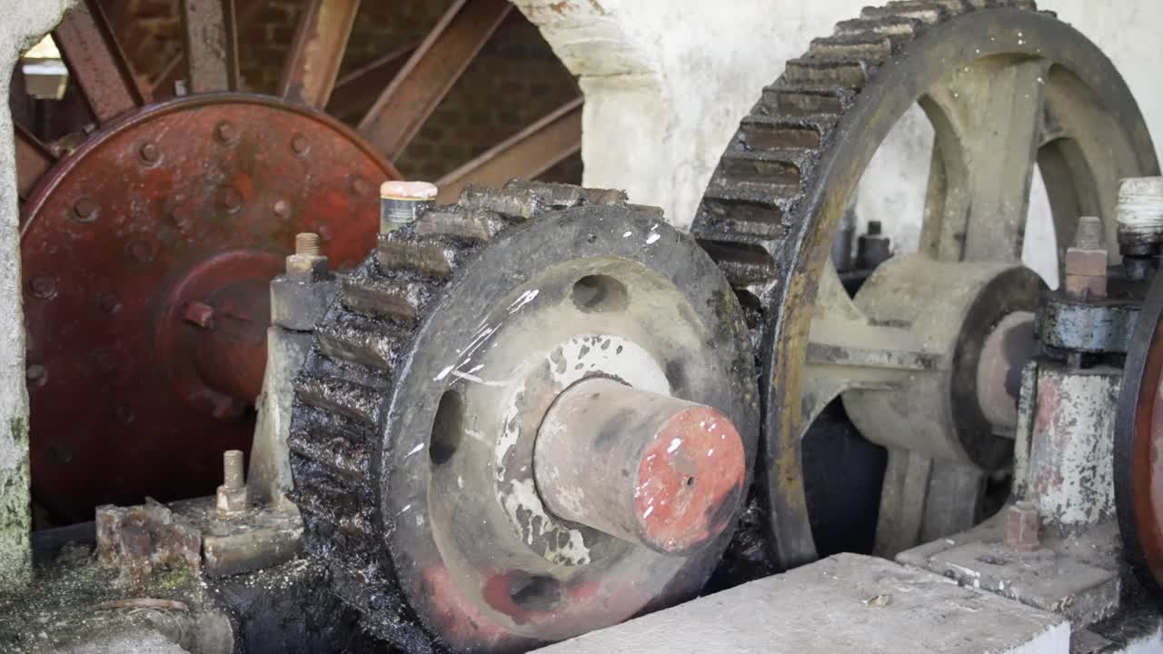 Close-up of Old, Greasy Gears in a Vintage Industrial Machine
