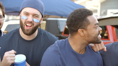 Slow-Motion-Shot-Of-Male-Sports-Fans-Tailgating-In-Car-Park