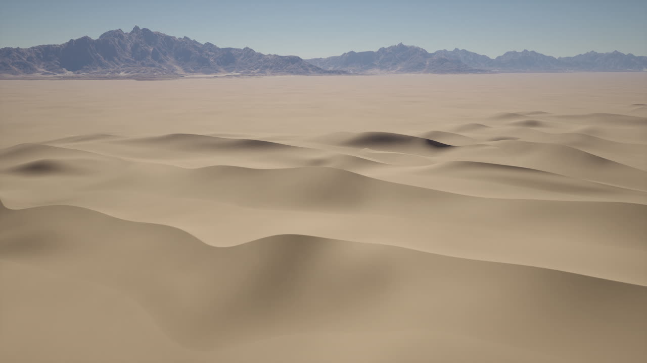 un vasto paisaje desértico con dunas de arena y montañas en la distancia