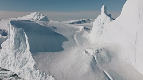 drone over sea and ice of ilulissat icefjord