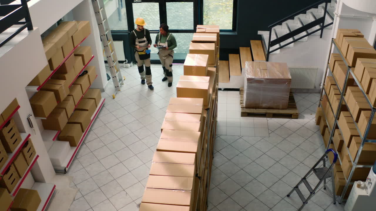 Warehouse workers inspecting boxes