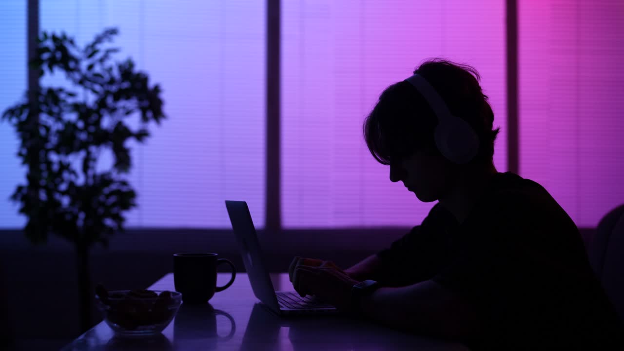 Teenager Studying at Night