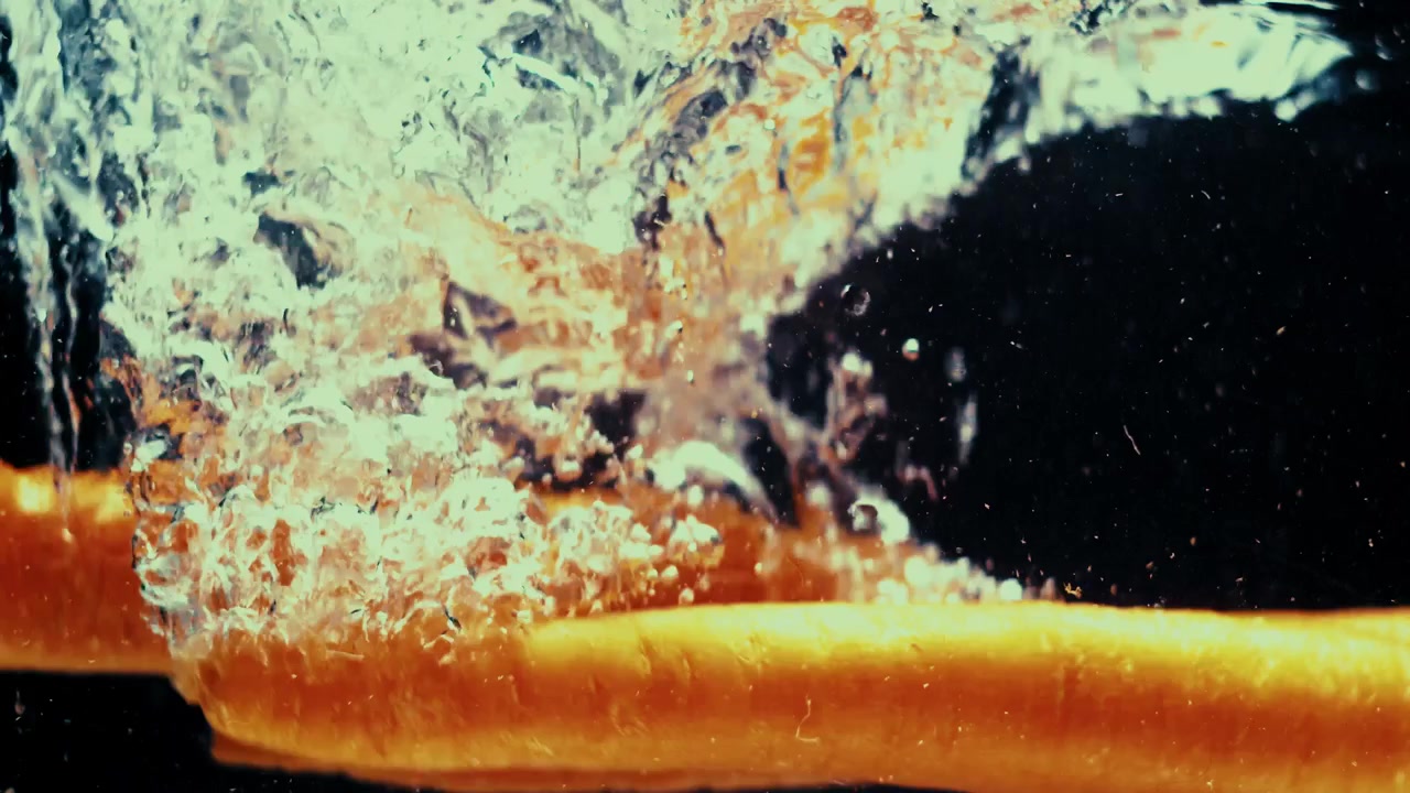 Carrots fall and create ripples behind them.