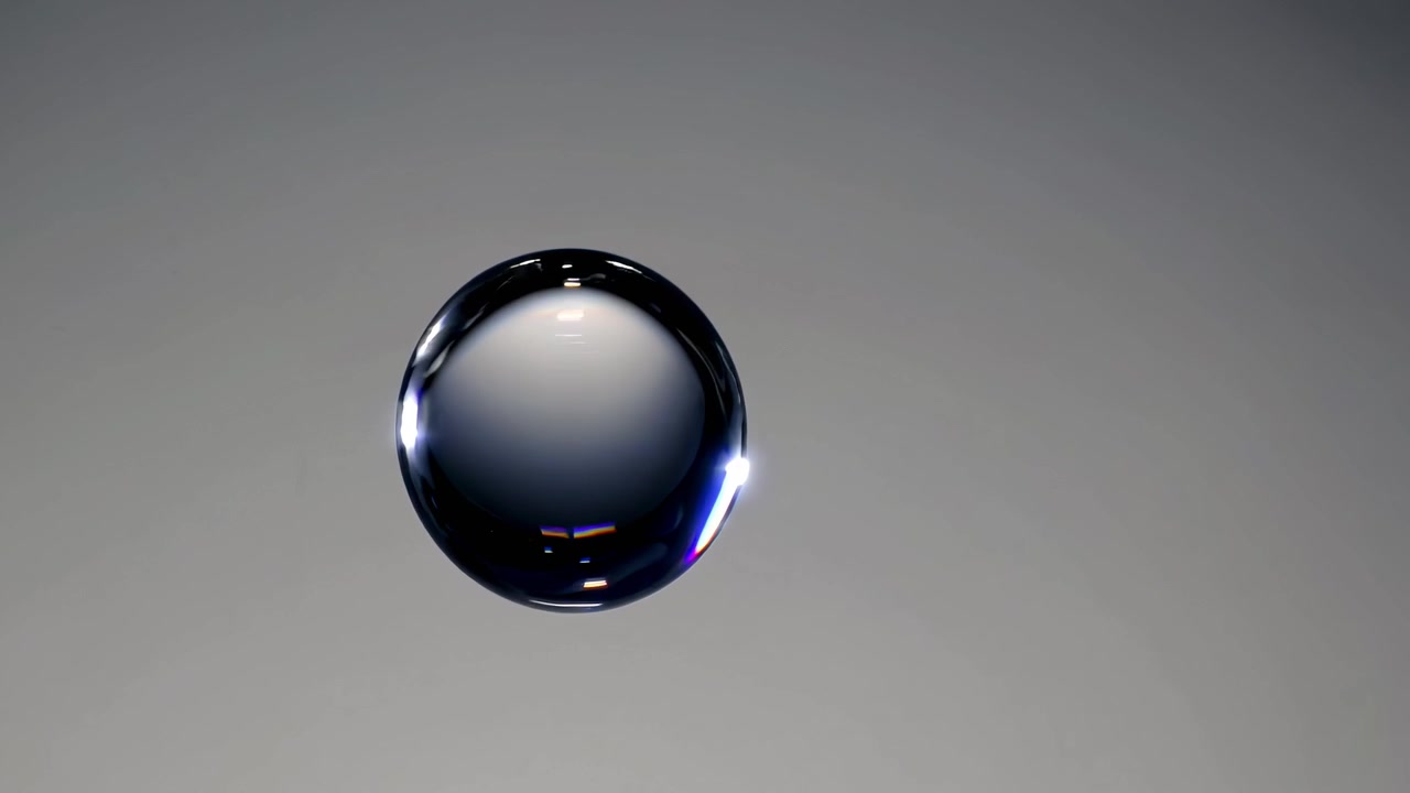 Perfect Spherical Water Drop Floating on Grey Background