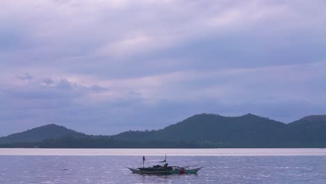 A-Fishing-Boat-Floating-on-the-Sea-Sunset-Blue-Hour-Static