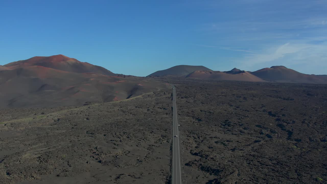 Aerial drone view of mountain sea and volcanoes in Lanzarote, Canary Islands, Spain