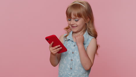 Child-girl-kid-use-mobile-smartphone-browsing-say-Wow-yes-found-out-great-win-good-news-celebrate