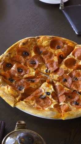 friends sharing pepperoni pizza