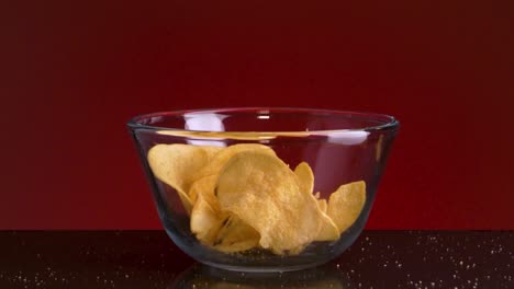 crispy potato chips in a glass bowl