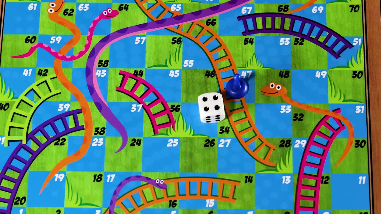 A close-up view of dice rolling and pieces moving on a vibrant Snakes and Ladders board.