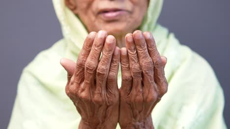 elderly woman in prayer