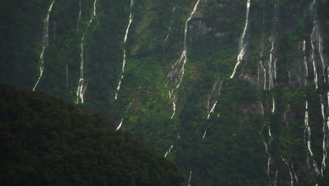 Beautiful-scenic-view-of-moutains-with-many-waterfall-after-rain-at-Millford-Sound,-New-Zealand