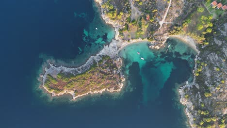 Scenic-Beach,-Bay,-Island-and-Nature-Landscape-at-Sithonia,-Halkidiki,-Greece---Aerial-4k