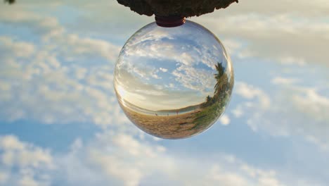 magic sunset view on the beach in a crystal ball.