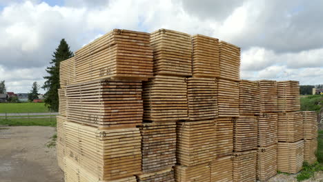 crane style shoot of lumber - stacked wood materials prepared for export