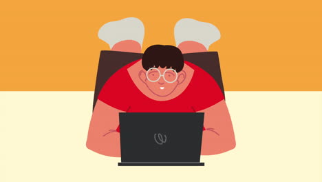 young man liying using laptop