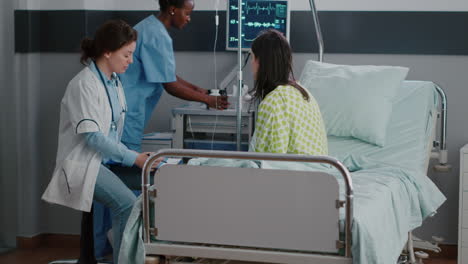 sick woman adult sitting in bed while practitioner examining disease