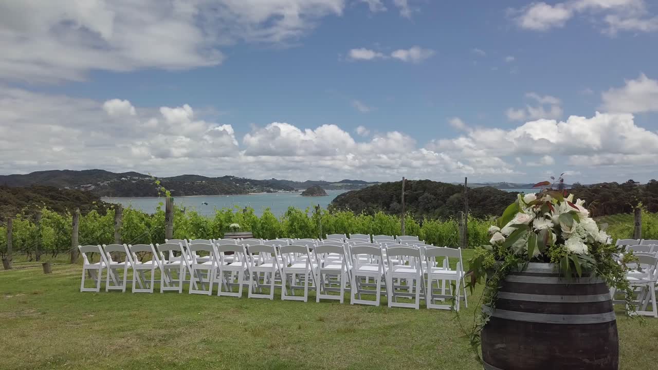 Welcome sign and chairs in a wedding celebration in a winery in New Zealand.