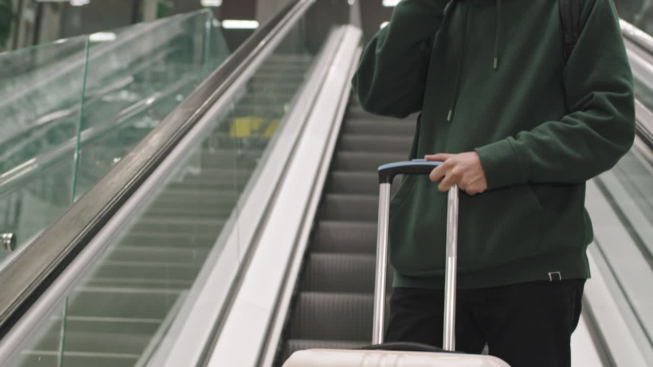 Man Enjoying Music On Escalator