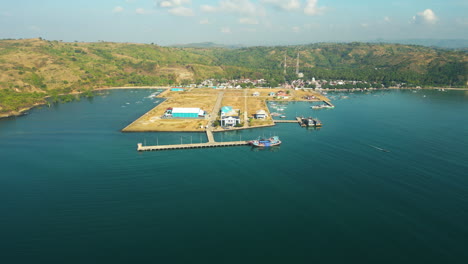 Panoramic-aerial-view-of-fishing-harbour-and-boat-on-the-Awang-bay,-Mertak,-Lombok-Tengah,-Indonesia