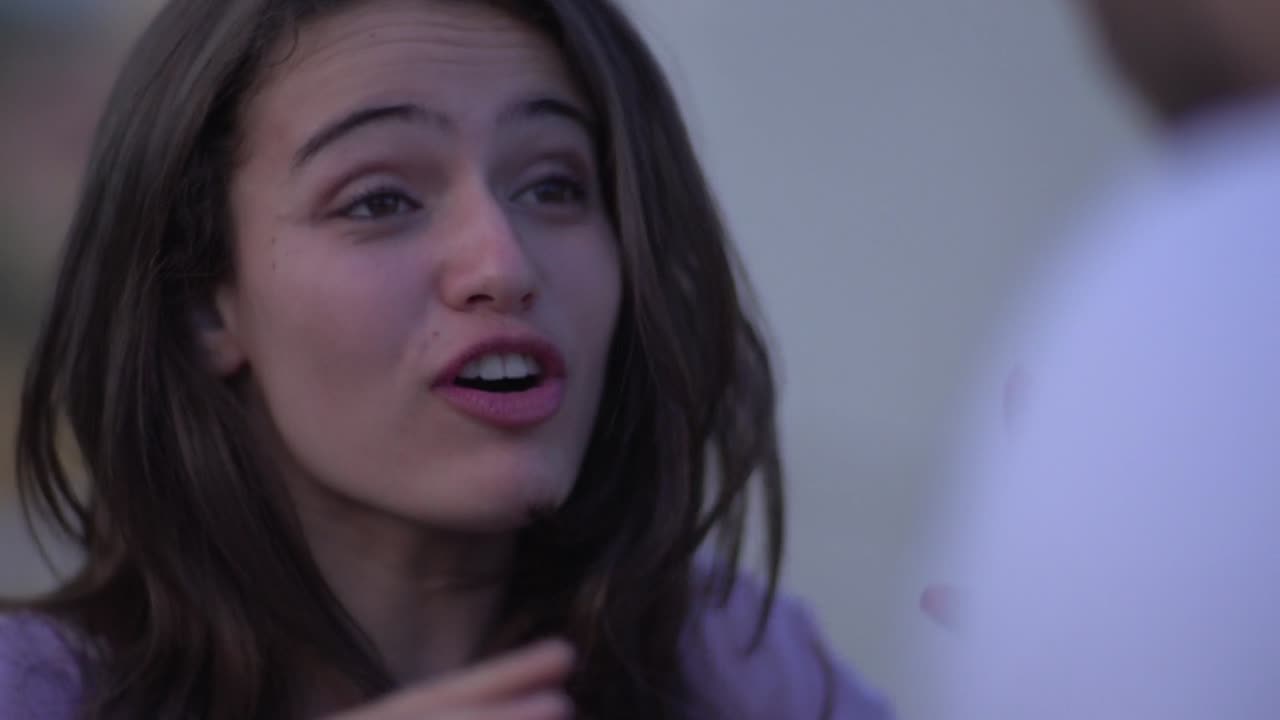 Close-up portrait of a young woman looking up