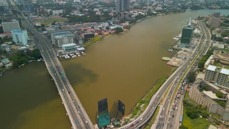 traffic and cityscape of victoria island, lagos, nigeria featuring falomo bridge, lagos law school and the civic centre tower