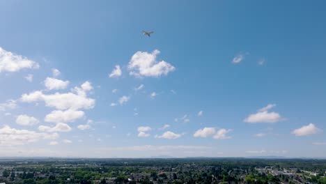 airplane leaving vancouver international airport flying over richmond city in british columbia, canada