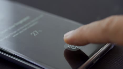 finger scanning fingerprint on mobile phone