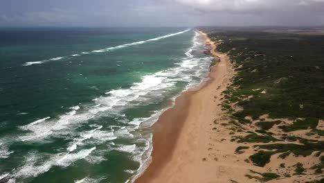 Stationary-Aerial-Shot-of-Endless-Chidenguele-Beach-in-Mozambique