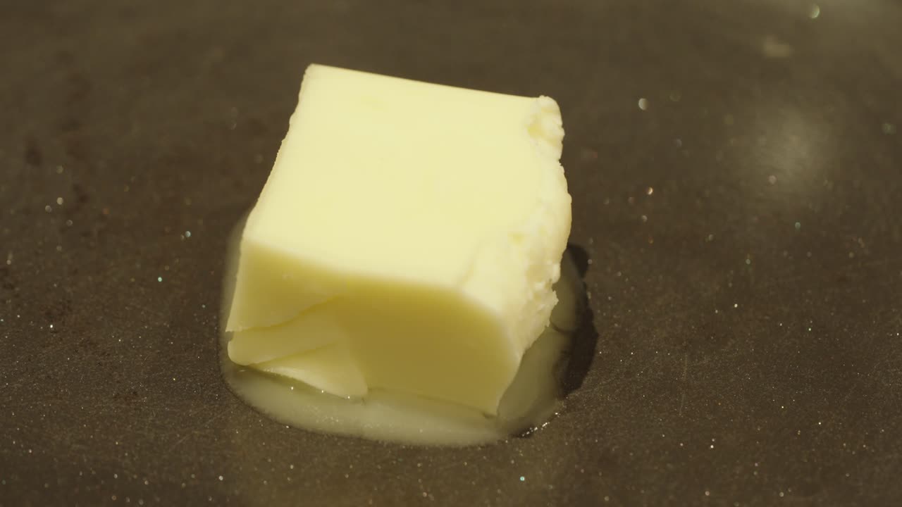 melt butter in a pan macro