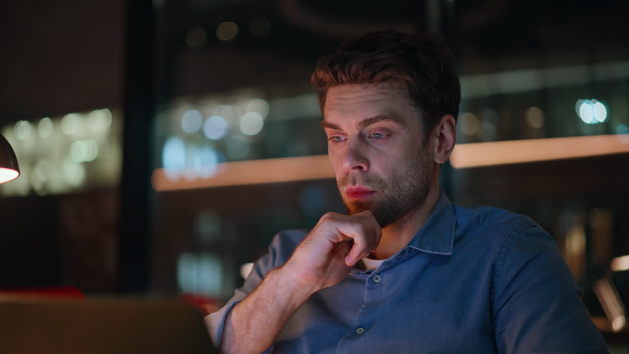 Exhausted businessman typing laptop late evening office closeup. Tired man night