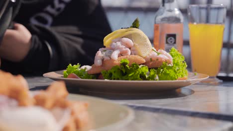 Delicious Shrimp Sandwich Enjoyed Outdoors on a Sunny Day