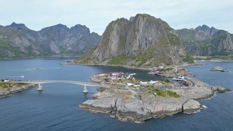 hamnoy village, fjords and scenic road in lofoten islands, norway - aerial 4k circling