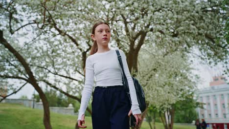 girl walking in a park during spring