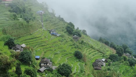 rural nepal remote village in himalayas with terraced paddy fields and rice paddies in himalaya mountains, rural villages with steep farming farm land in himalayas mountains