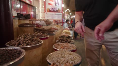 tourists choosing spices at the market