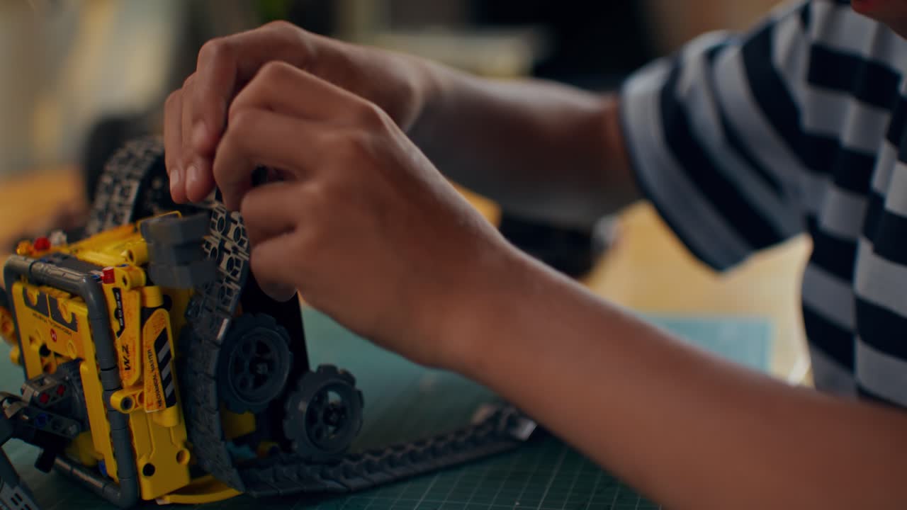 Child Building a Lego Robot Toy