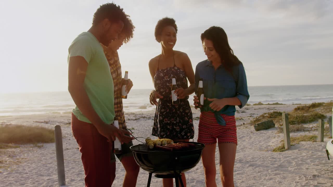 Friends cooking food on barbecue at beach 4k